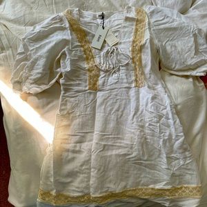 Brand New RAHI Dress with Tags. Never Worn. Color White. Size: Medium